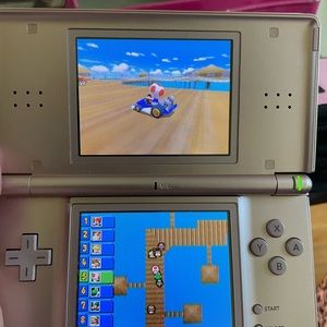 Nintendo DS with games, accessories, charger, and carrying case